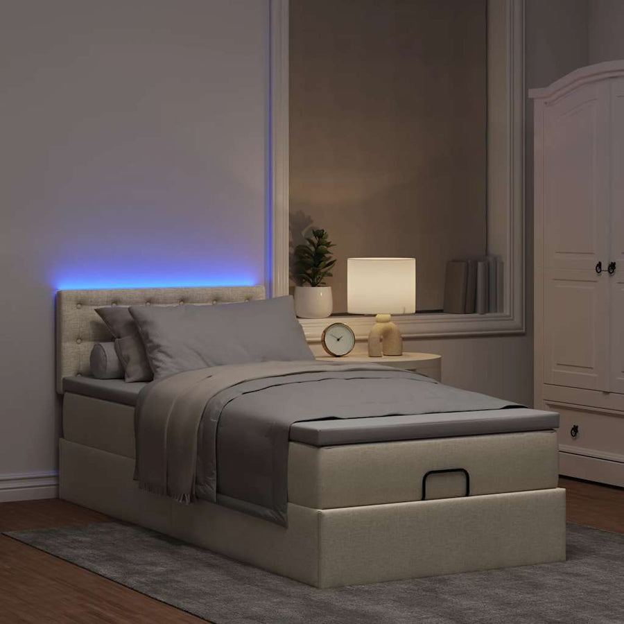 Ottoman bed met matras en LED's 90x200 cm stof crèmekleurig