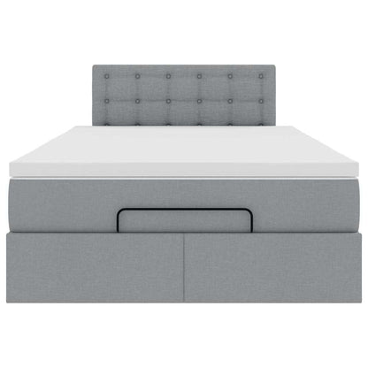 Ottoman bed met matras en LED's 120x190 cm stof lichtgrijs