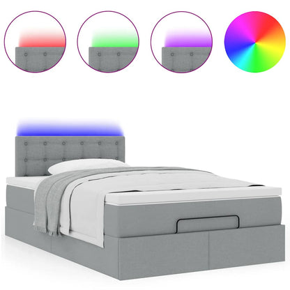Ottoman bed met matras en LED's 120x200 cm stof lichtgrijs