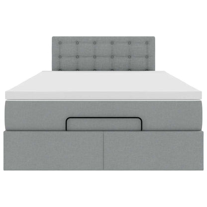 Ottoman bed met matras en LED's 120x200 cm stof lichtgrijs