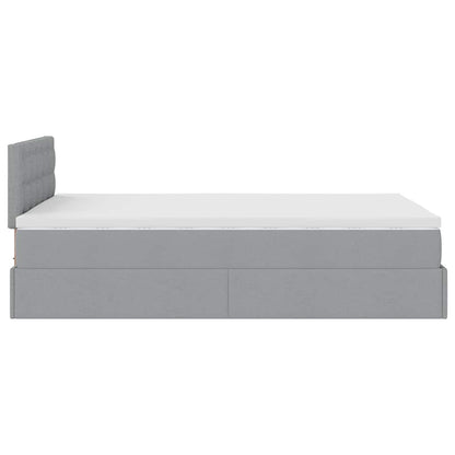 Ottoman bed met matras en LED's 120x200 cm stof lichtgrijs