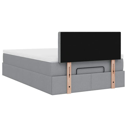 Ottoman bed met matras en LED's 120x200 cm stof lichtgrijs