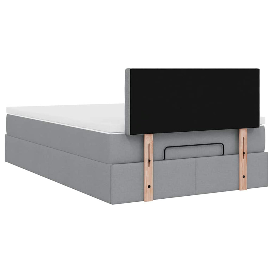 Ottoman bed met matras en LED's 120x200 cm stof lichtgrijs