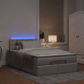 Ottoman bed met matras en LED's 120x200cm stof taupe