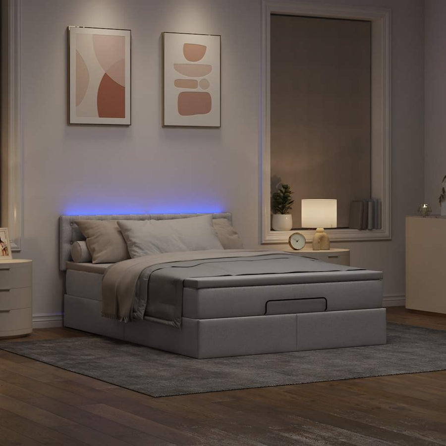 Ottoman bed met matras en LED's 140x200 cm stof taupe