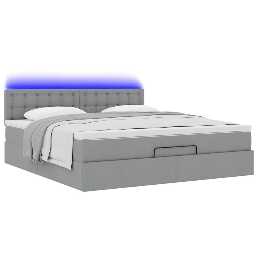 Ottoman bed met matras en LED's 160x200 cm stof lichtgrijs