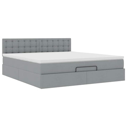 Ottoman bed met matras en LED's 160x200 cm stof lichtgrijs