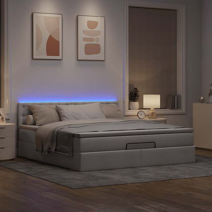 Ottoman bed met matras en LED's 160x200cm stof taupe