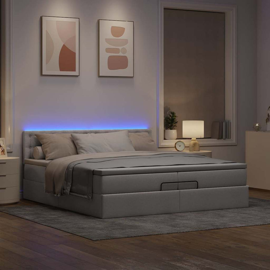 Ottoman bed met matrassen en LED's 200x200cm stof taupe