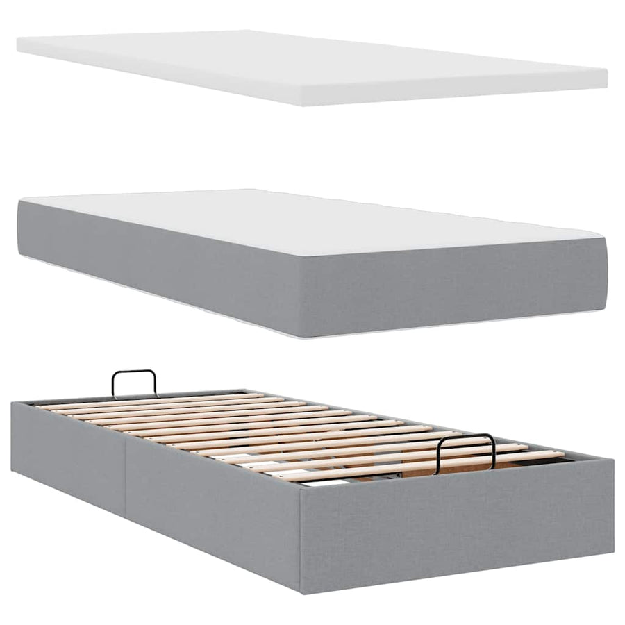 Ottoman bed met matrassen en LED's 180x200cm stof lichtgrijs