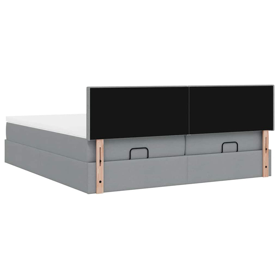 Ottoman bed met matrassen en LED's 180x200cm stof lichtgrijs
