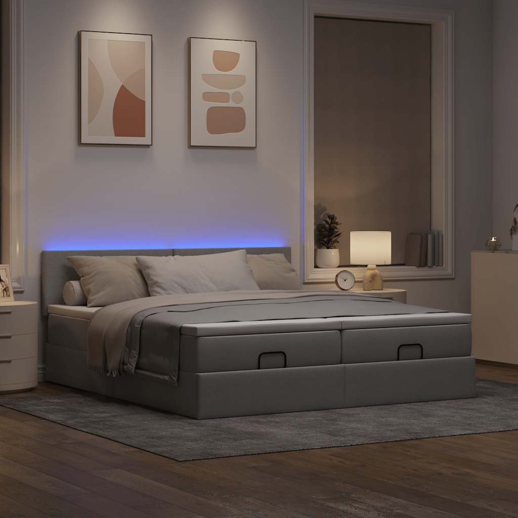 Ottoman bed met matrassen en LED's 180x200cm stof lichtgrijs