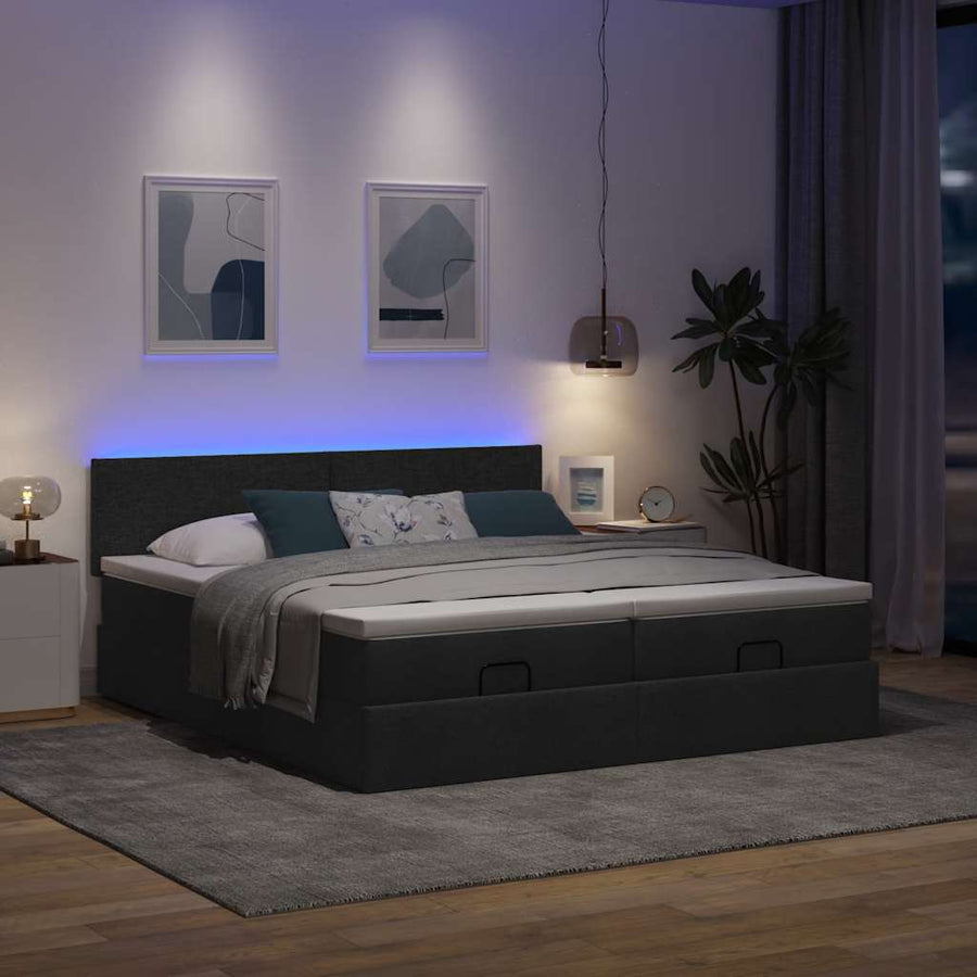 Ottoman bed met matrassen en LED's 180x200cm stof zwart