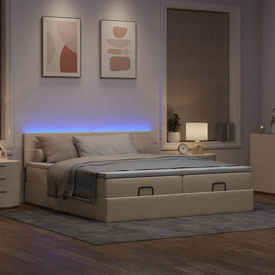Ottoman bed met matrassen en LED's 160x200cm stof crèmekleurig