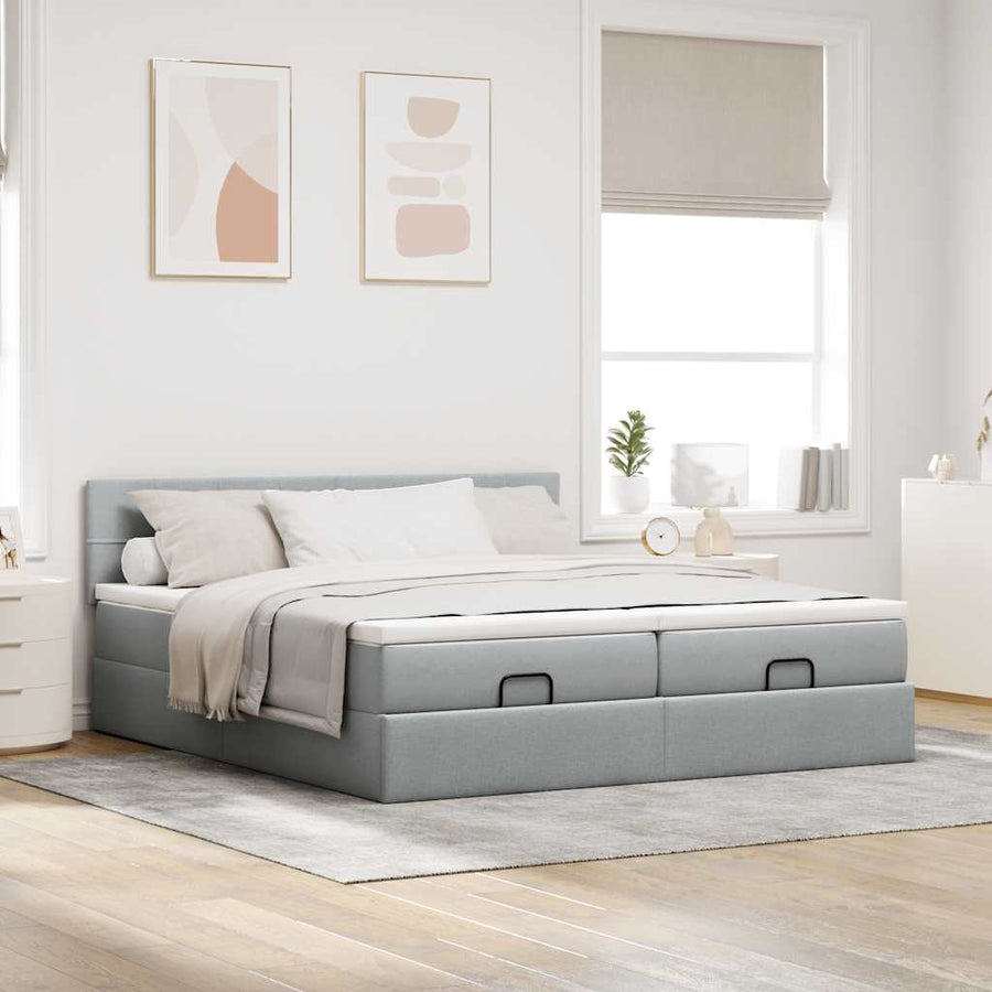Ottoman bed met matrassen en LED's 180x200cm stof lichtgrijs