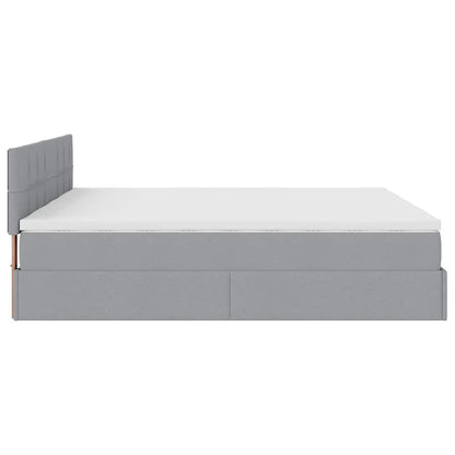 Ottoman bed met matrassen en LED's 180x200cm stof lichtgrijs