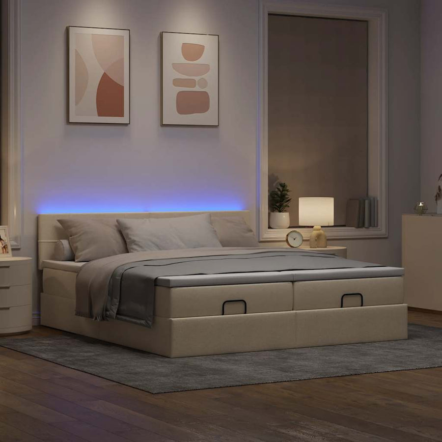 Ottoman bed met matrassen en LED's 180x200cm stof crèmekleurig