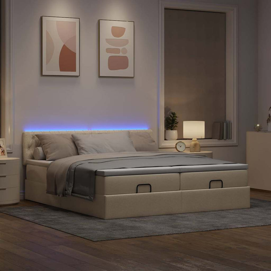 Ottoman bed met matrassen en LED's 180x200cm stof crèmekleurig