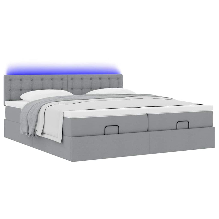 Ottoman bed met matrassen en LED's 180x200cm stof lichtgrijs