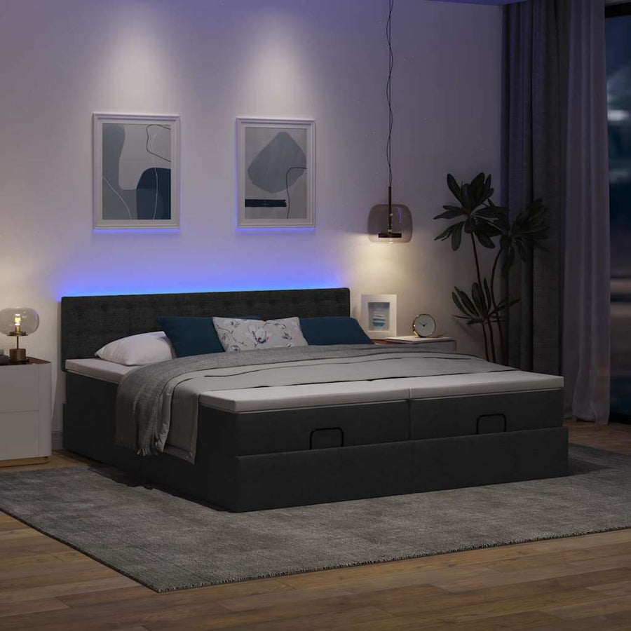 Ottoman bed met matrassen en LED's 180x200cm stof zwart