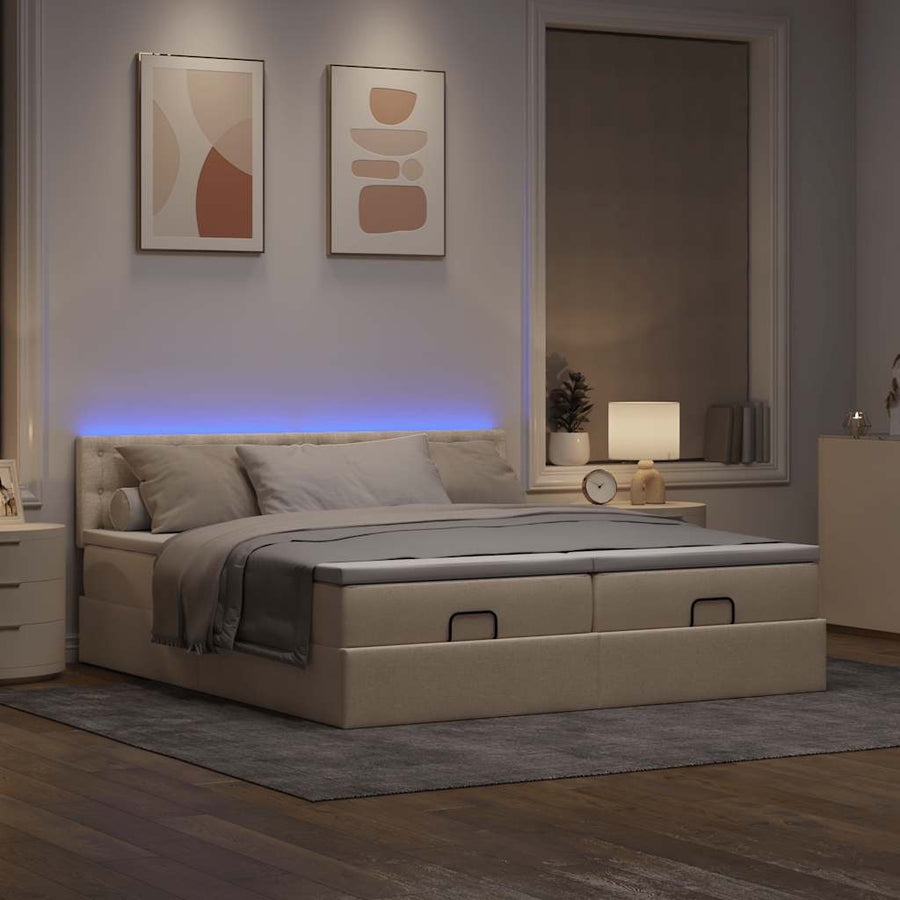 Ottoman bed met matrassen en LED's 180x200cm stof crèmekleurig