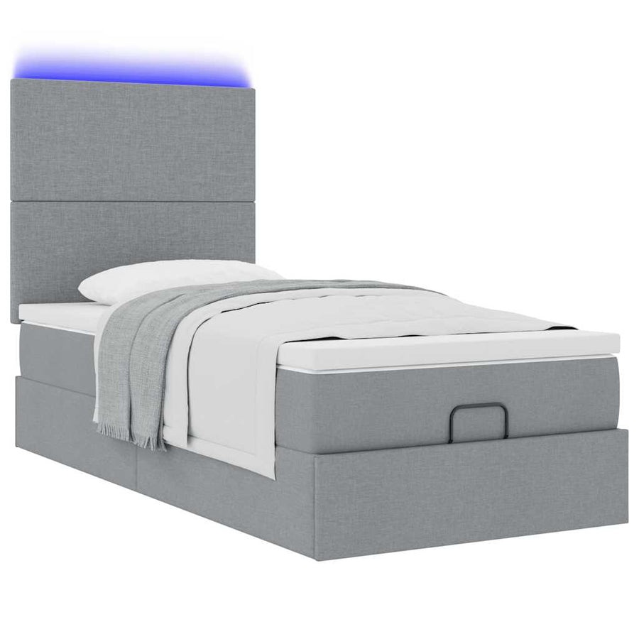 Ottoman bed met matras en LED's 80x200cm stof lichtgrijs
