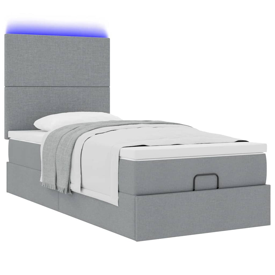 Ottoman bed met matras en LED's 90x190cm stof lichtgrijs