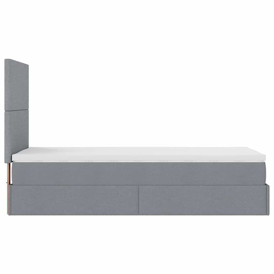 Ottoman bed met matras en LED's 90x200cm stof lichtgrijs
