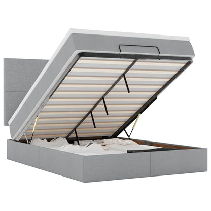Ottoman bed met matras en LED's 140x190cm stof lichtgrijs