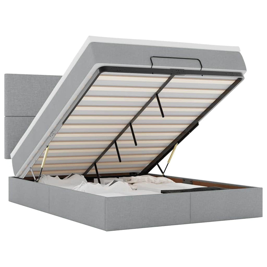 Ottoman bed met matras en LED's 140x190cm stof lichtgrijs
