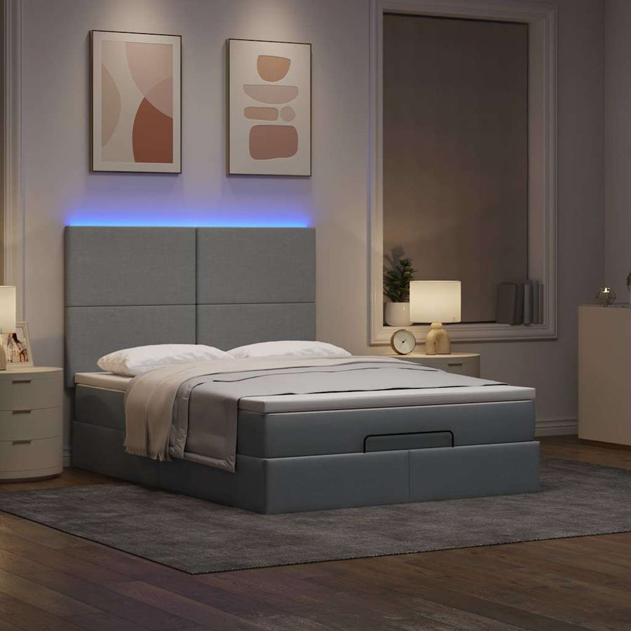 Ottoman bed met matras en LED's 140x190cm stof lichtgrijs