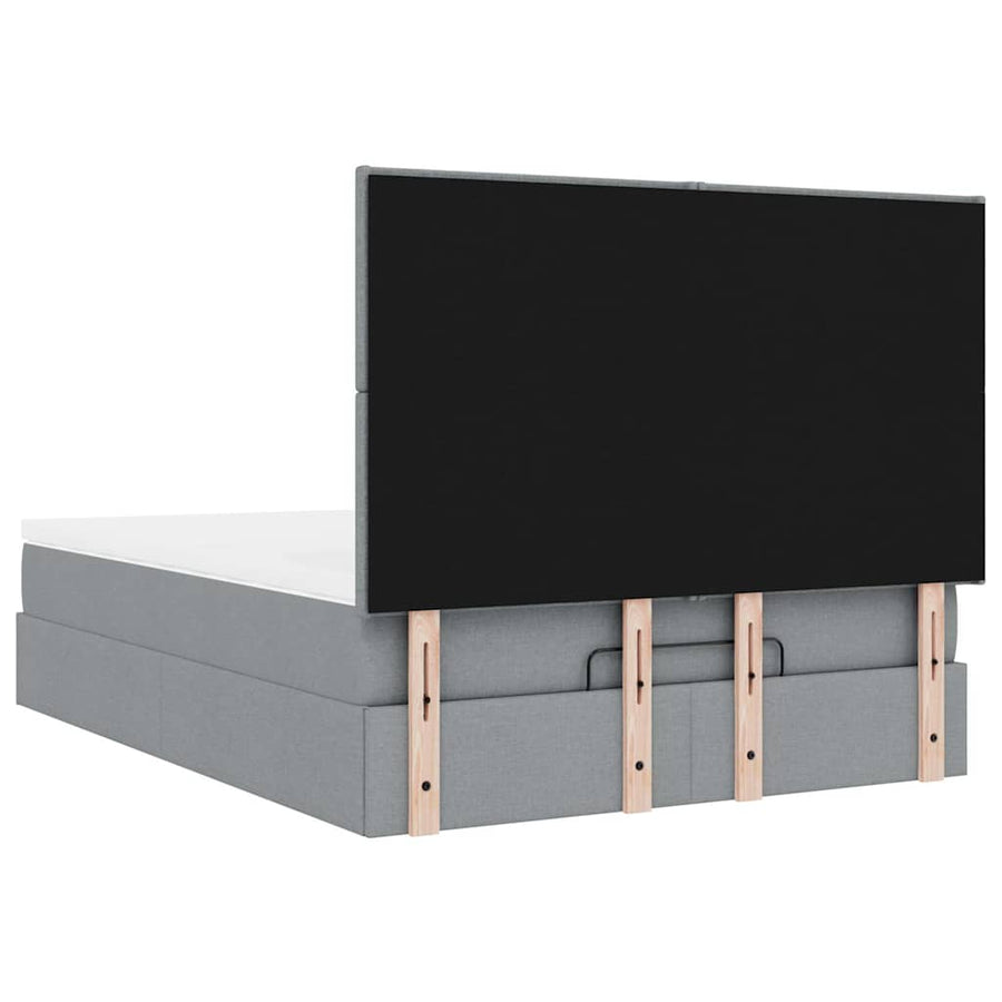 Ottoman bed met matras en LED's 140x190cm stof lichtgrijs