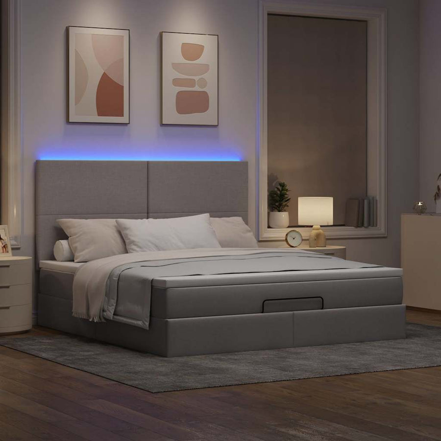 Ottoman bed met matras en LED's 180x200cm stof taupe