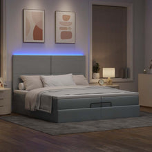 Ottoman bed met matrassen en LED's 200x200cm stof lichtgrijs
