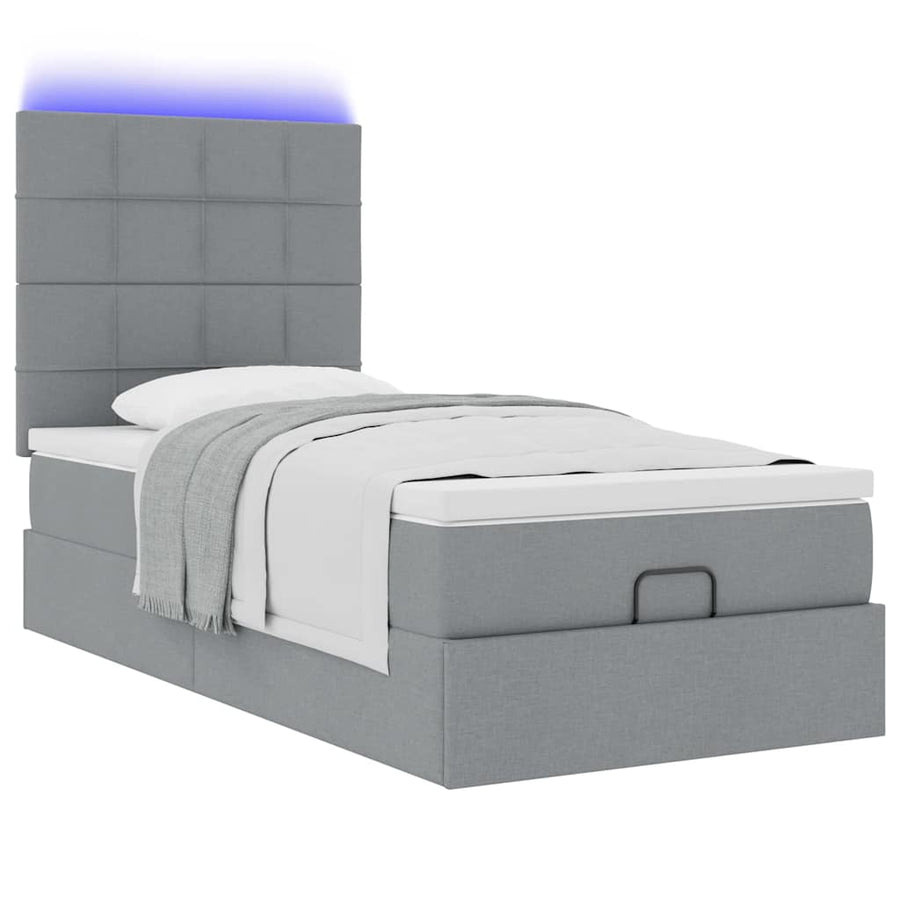 Ottoman bed met matras en LED's 90x200cm stof lichtgrijs
