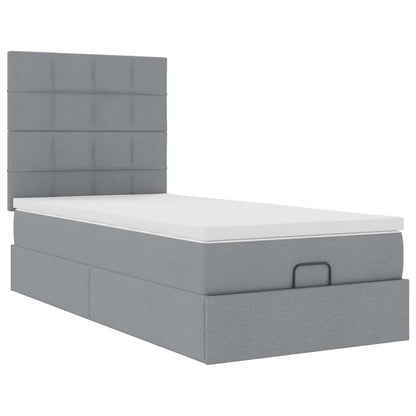 Ottoman bed met matras en LED's 90x200cm stof lichtgrijs