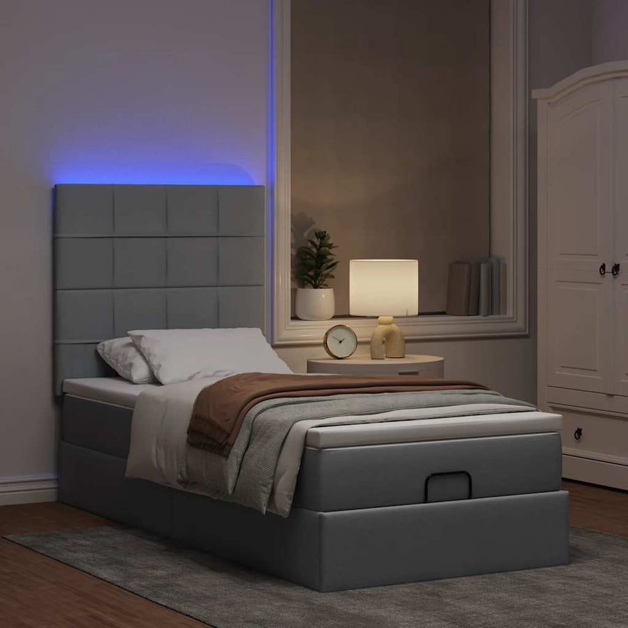 Ottoman bed met matras en LED's 100x200cm stof lichtgrijs