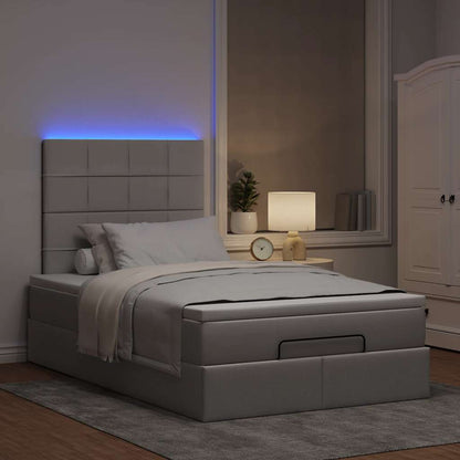 Ottoman bed met matras en LED's 120x200cm stof taupe