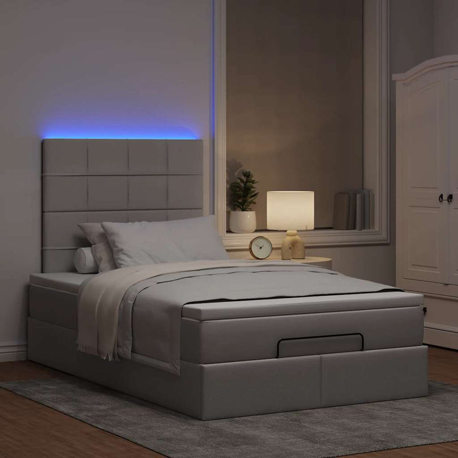 Ottoman bed met matras en LED's 120x200cm stof taupe