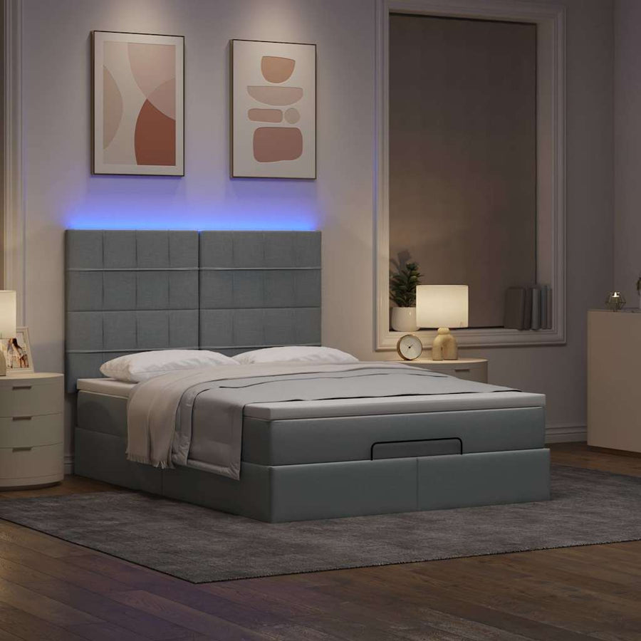 Ottoman bed met matras en LED's 140x190cm stof lichtgrijs