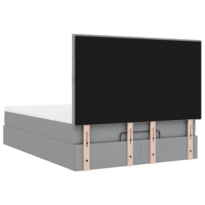 Ottoman bed met matras en LED's 140x190cm stof lichtgrijs