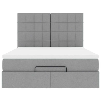 Ottoman bed met matras en LED's 140x190cm stof lichtgrijs