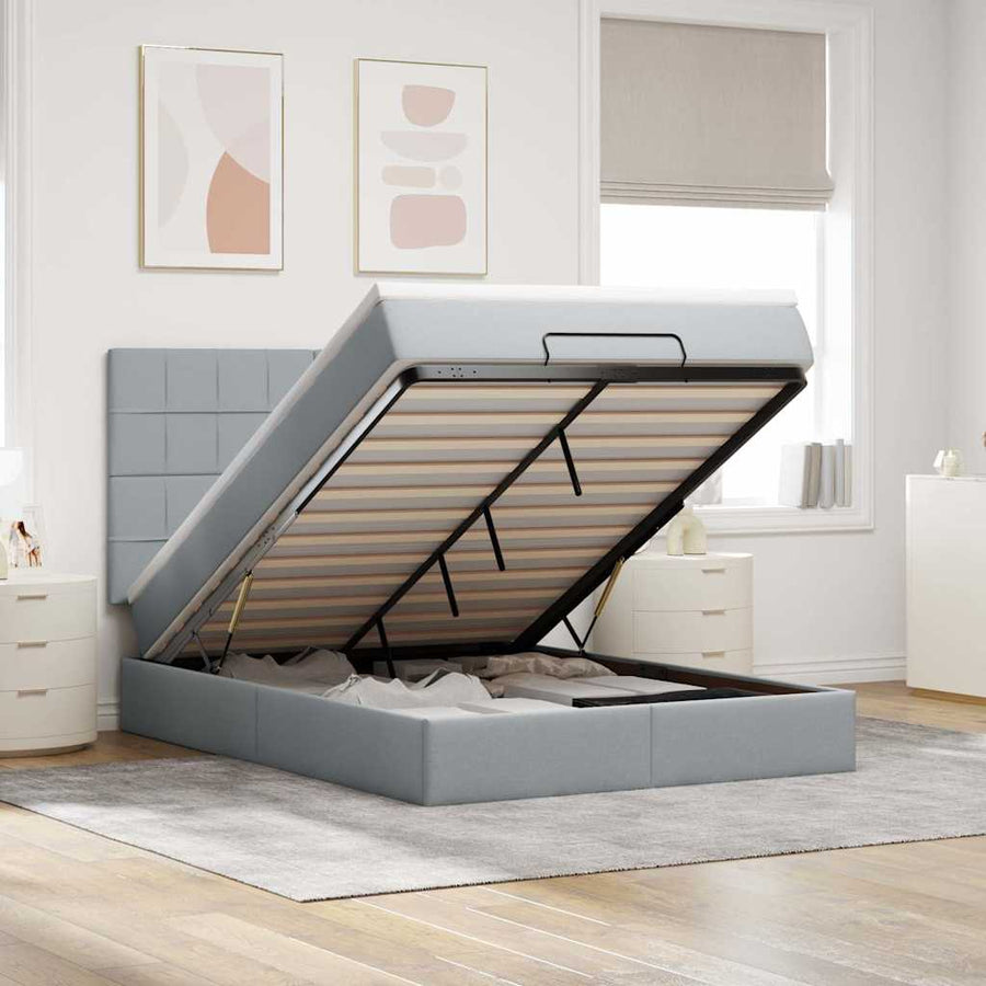 Ottoman bed met matras en LED's 140x190cm stof lichtgrijs