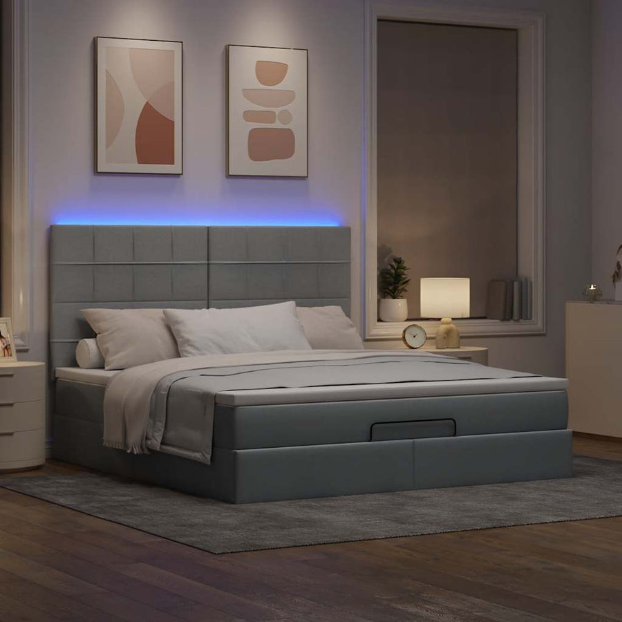Ottoman bed met matras en LED's 160x200cm stof lichtgrijs