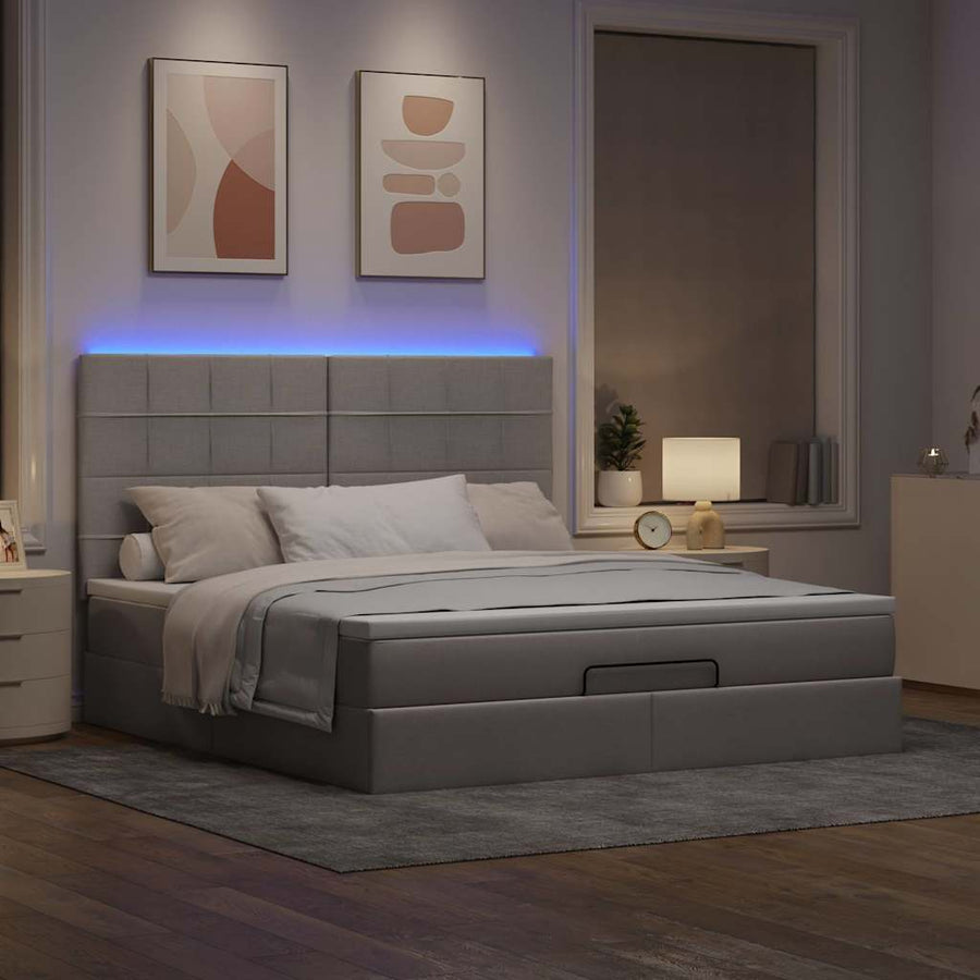 Ottoman bed met matras en LED's 180x200cm stof taupe