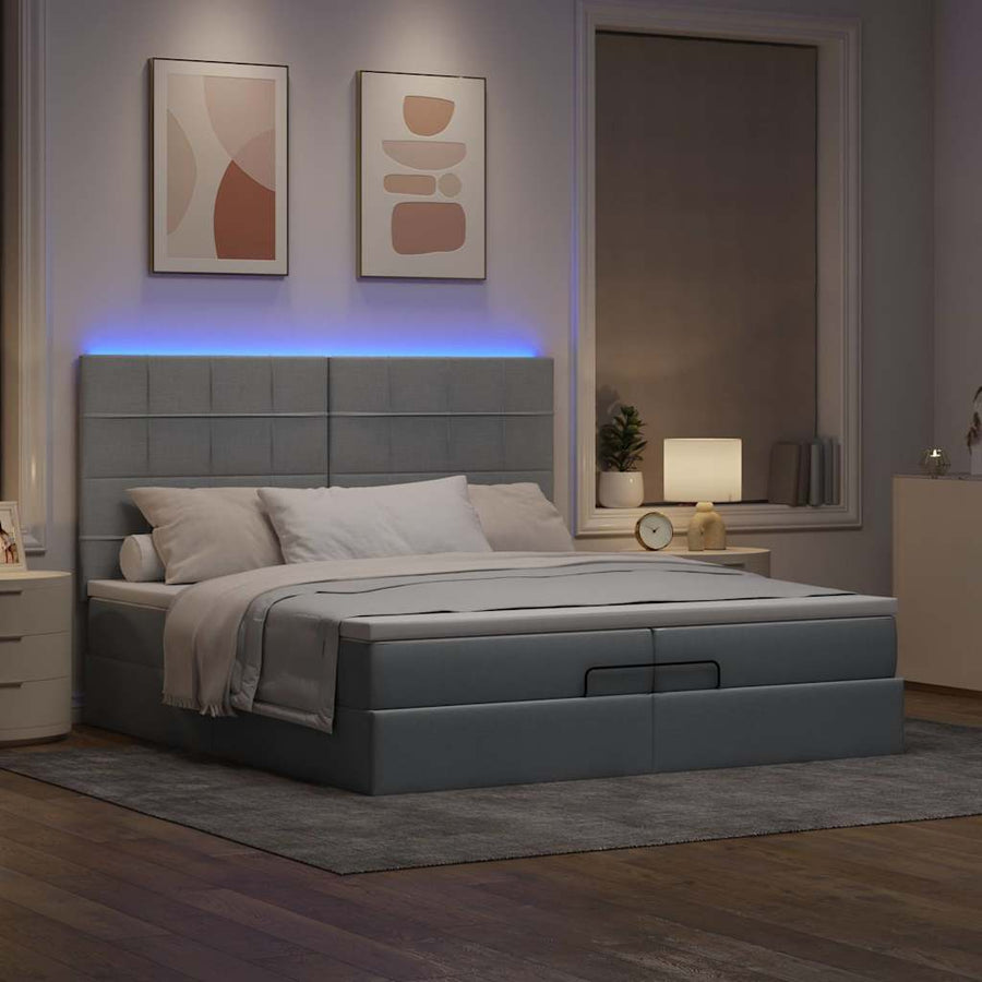 Ottoman bed met matrassen en LED's 200x200cm stof lichtgrijs