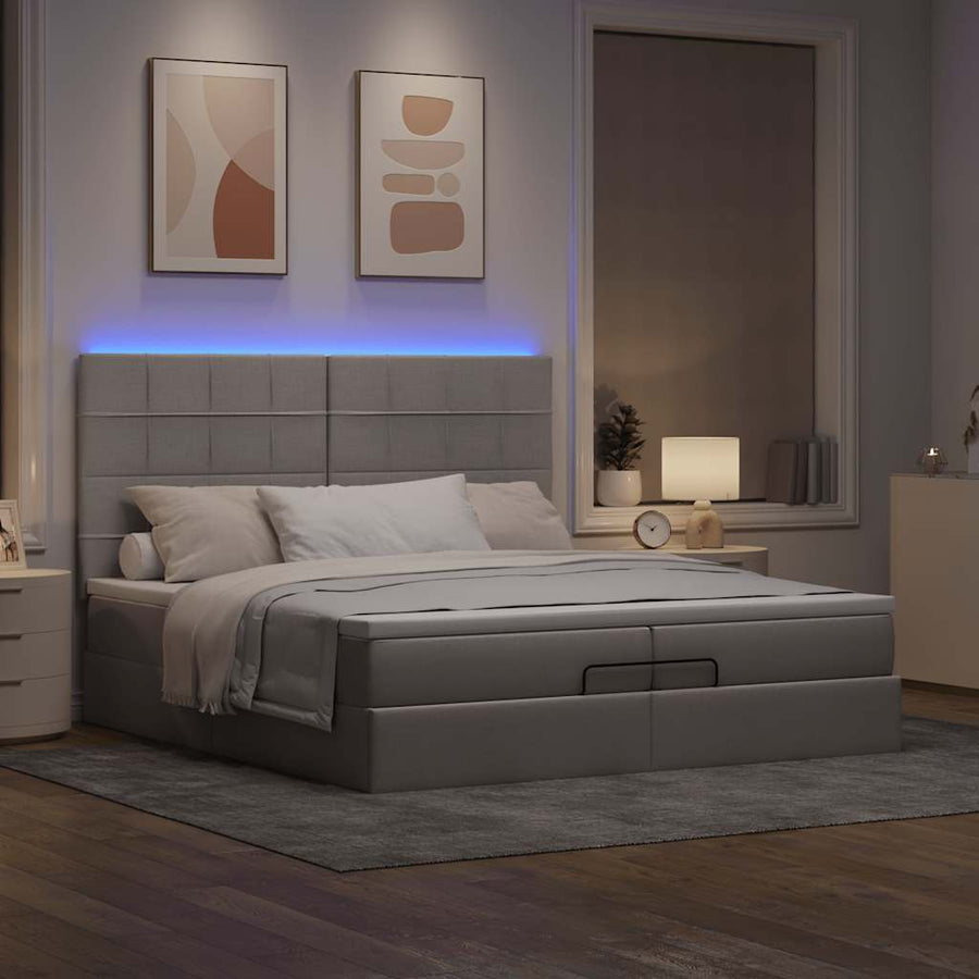 Ottoman bed met matrassen en LED's 200x200cm stof taupe