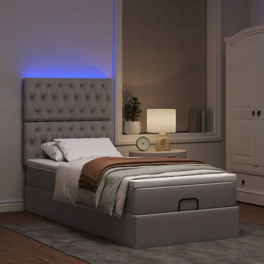 Ottoman bed met matras en LED's 80x200cm stof taupe