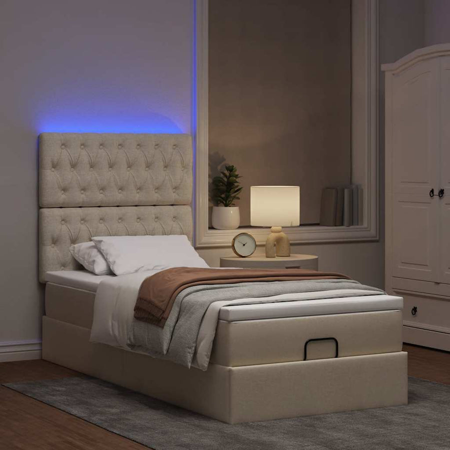 Ottoman bed met matras en LED's 80x200cm stof crèmekleurig