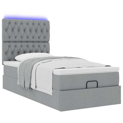 Ottoman bed met matras en LED's 90x200cm stof lichtgrijs